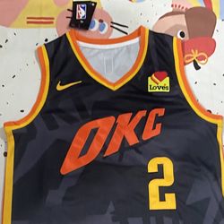 Oklahoma City Thunder Player Gilgeous Alexander (Number 2) In A Dark Camouflage Jersey.

