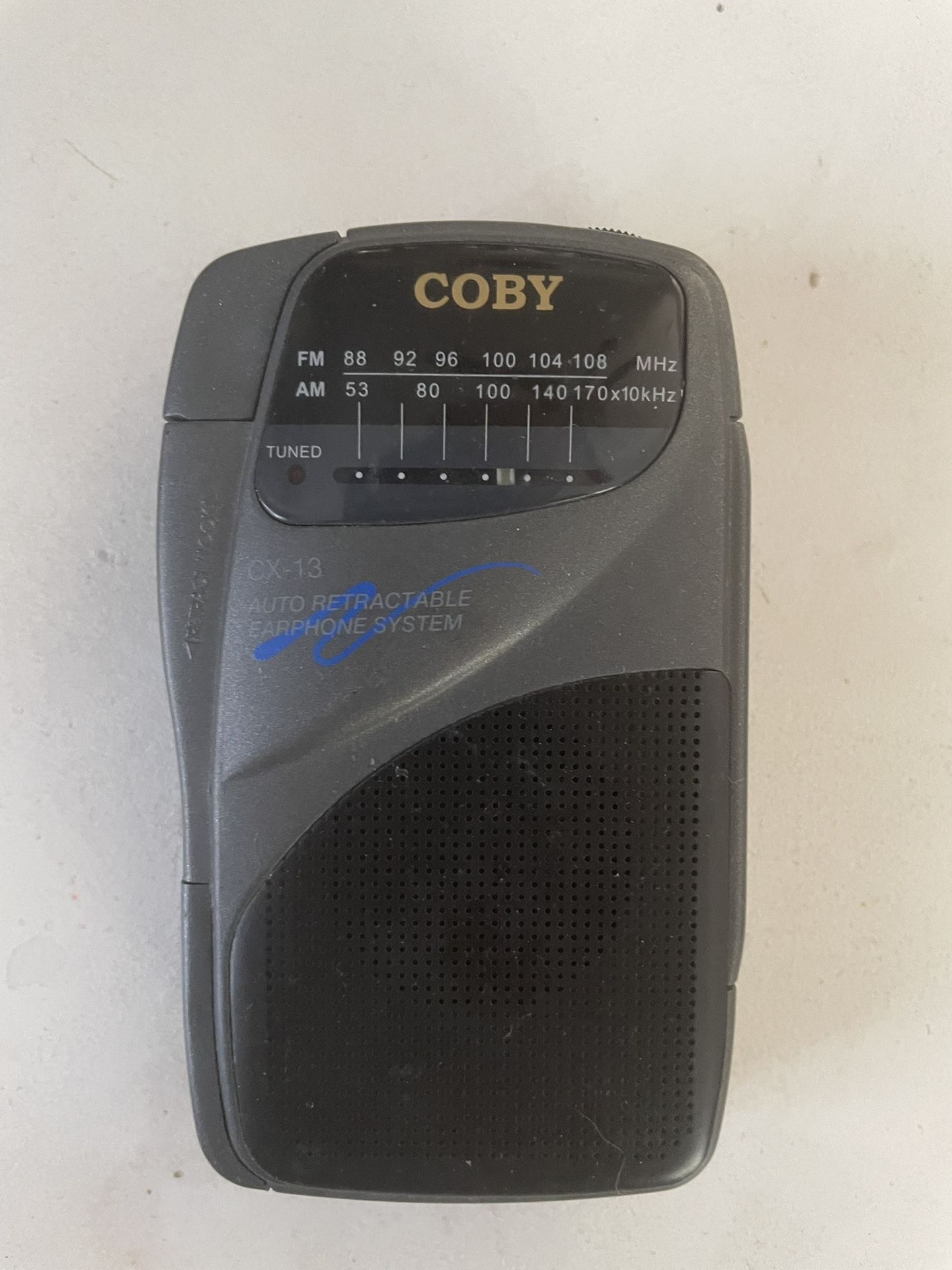 AM/FM Portable Radio With Enclosed Ear Bud
