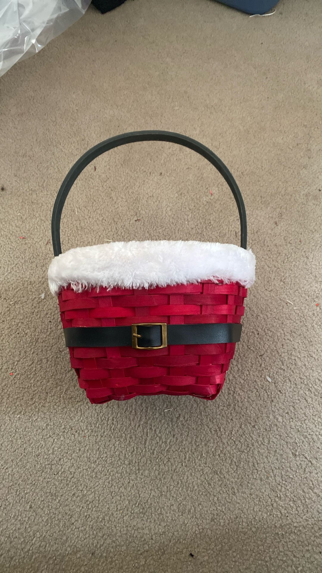 Festive red basket with a Santa belt design.