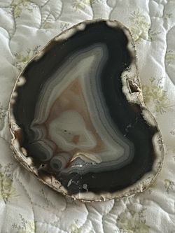 This item is a polished agate slab featuring banded gray, white, and translucent layers, likely originating from Brazil or Botswana.