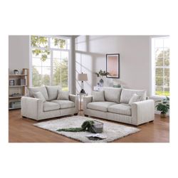 Beautiful modern 2-piece sofa set in a soft cream tone, originally used for professional home staging.
