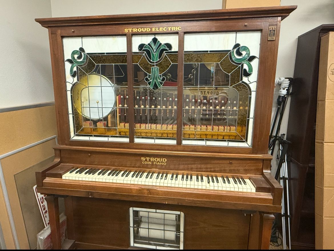Beautiful 1911 Stroud electric player piano.