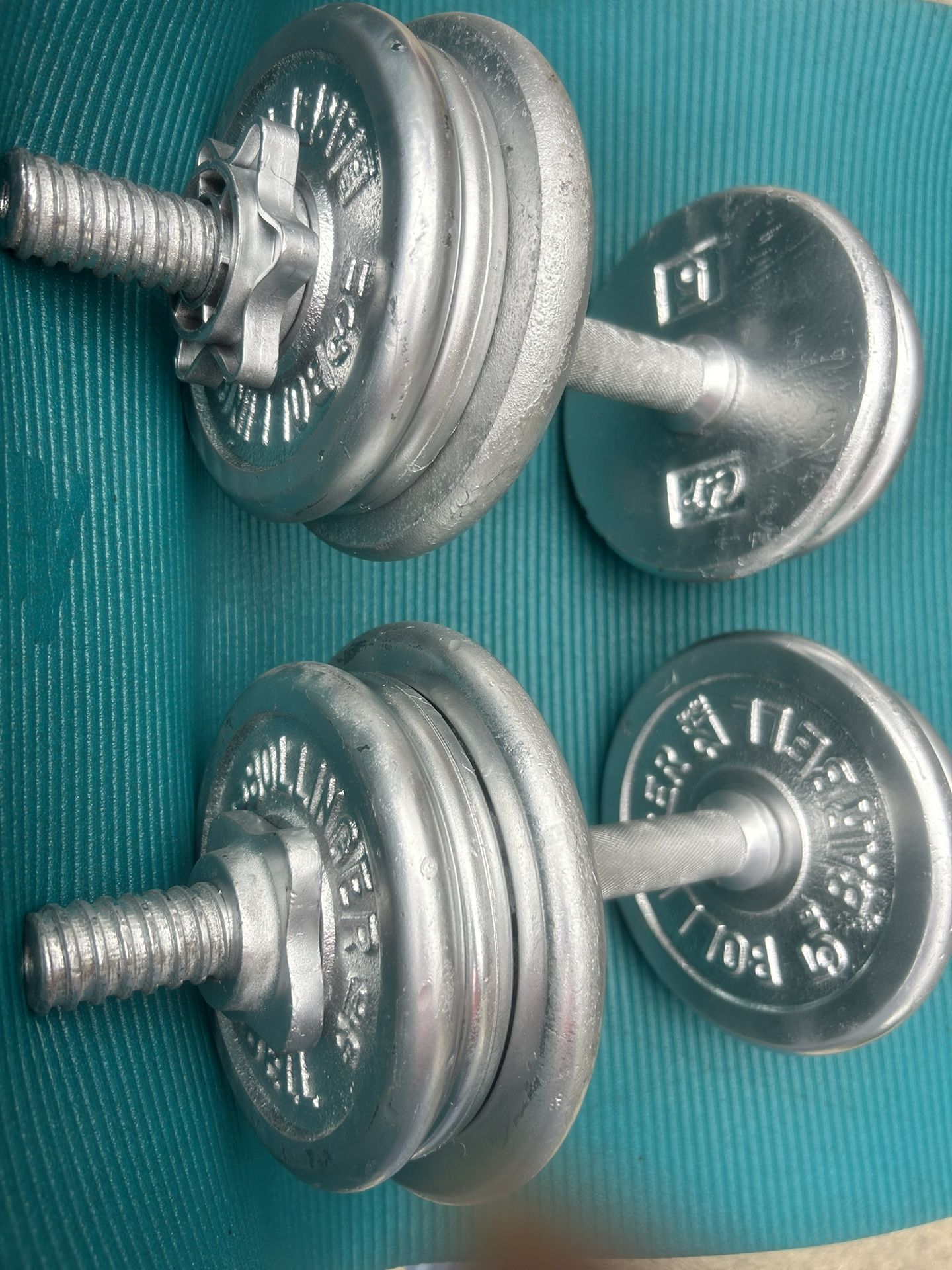 Two Dumbbells Of 26 Pounds Each