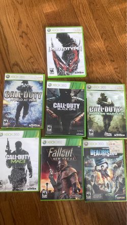 Stack of Modern Warfare XBOX 360 games