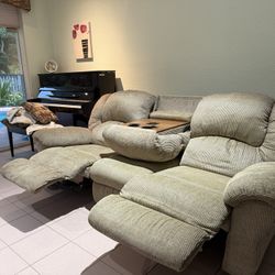 recline-able sofa with massage setting and cup holders 