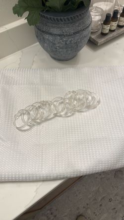 White shower curtain with clear shower rings