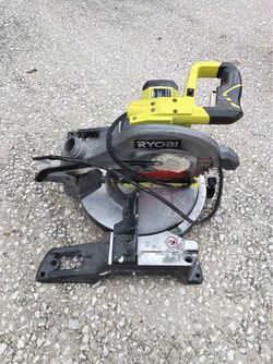 This is a Ryobi 10-inch Compound Miter Saw, likely model TS1346, which features a distinct neon green and black color scheme.