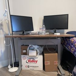 TEKNION Desk Or Office Table With 2 Monitors And A Lamp