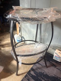 Glass table and 4 brown leather chairs