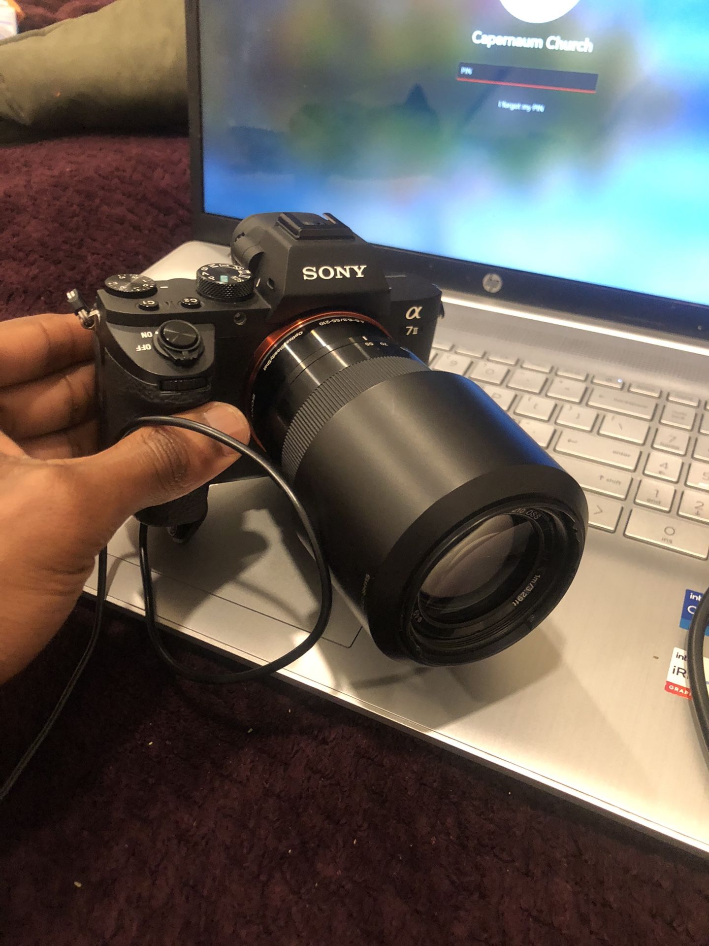  Sonny digital camera model “SEL55210 Sony Corp” ($400)  
