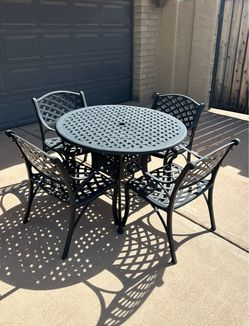 Patio set. Very nice condition. All metal. Table and chairs.