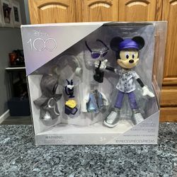 Walt Disney Parks 100 Years of Wonder Mickey Mouse Doll & Accessories Set.  Brand new never opened.  The box has damage see pictures.  The bottom has 