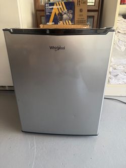 Semi new whirlpool smoll refrigerator with freezer