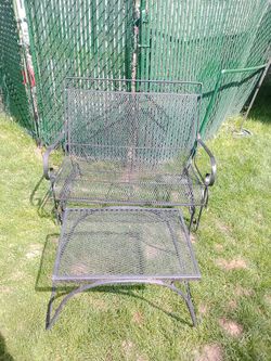 wrought iron glider sofa and table