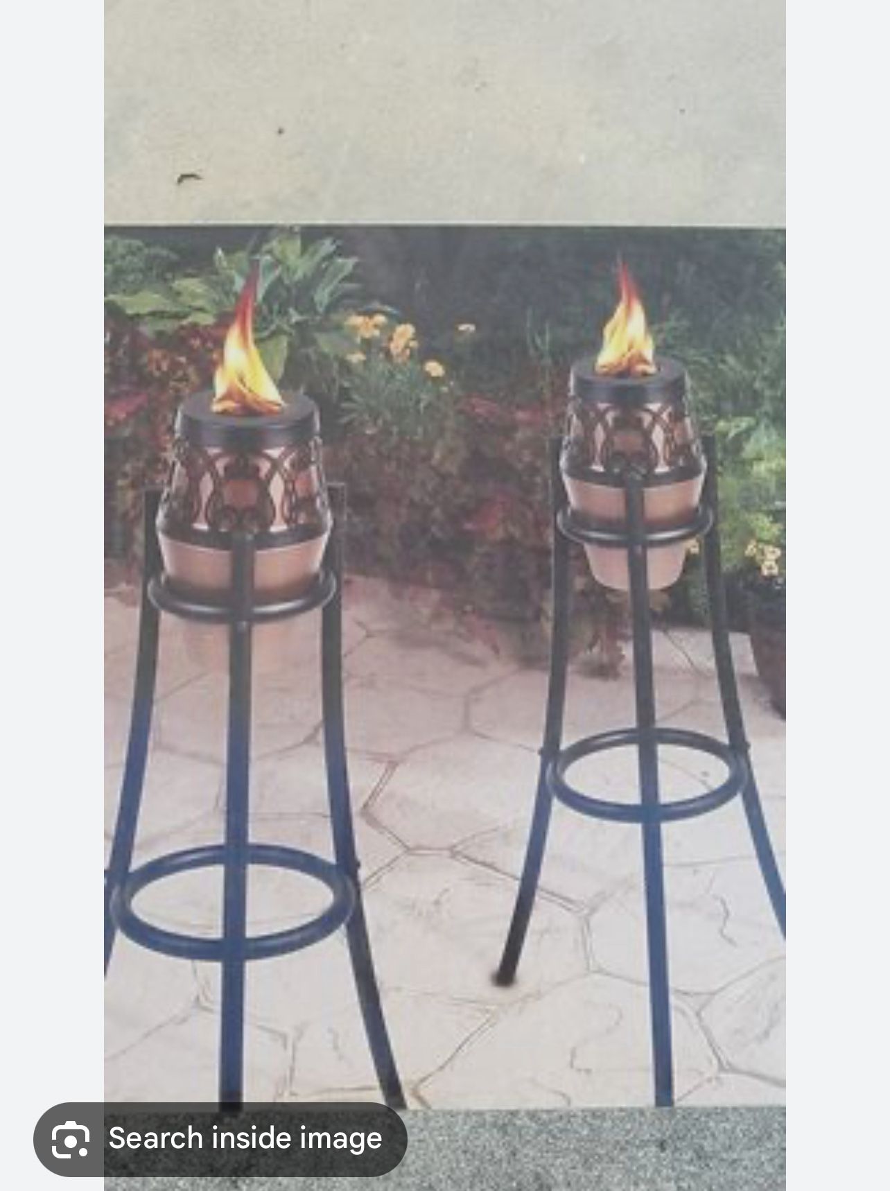 Two tiki oil lamps, and two containers of oil