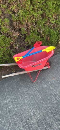 Kids wheelbarrow shovel and rack