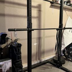 Rogue Squat Rack, Bar Bell, And Bumper Plates 