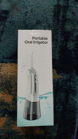 Portable oral irrigator water flosser. Brand New sealed box