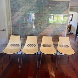 Four Calligaris Jam Sled base dining chairs, made in Italy