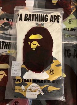 Brand new yellow bathing ape tee shirt