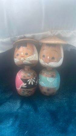 A pair of vintage Japanese Kokeshi bobble head wooden dolls.