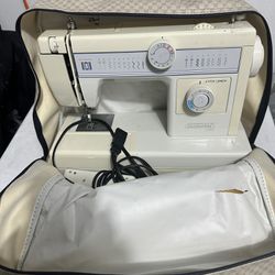 Riccar Sewing Machine with case and accessories.