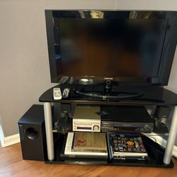TV With TV Stand, VHS, Two Bose Speakers With Subwoofer And DVD Player