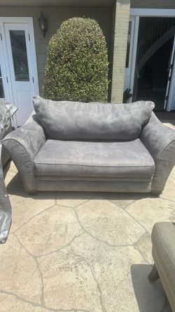 Grey couch, and love seat used but good condition recently cleaned.