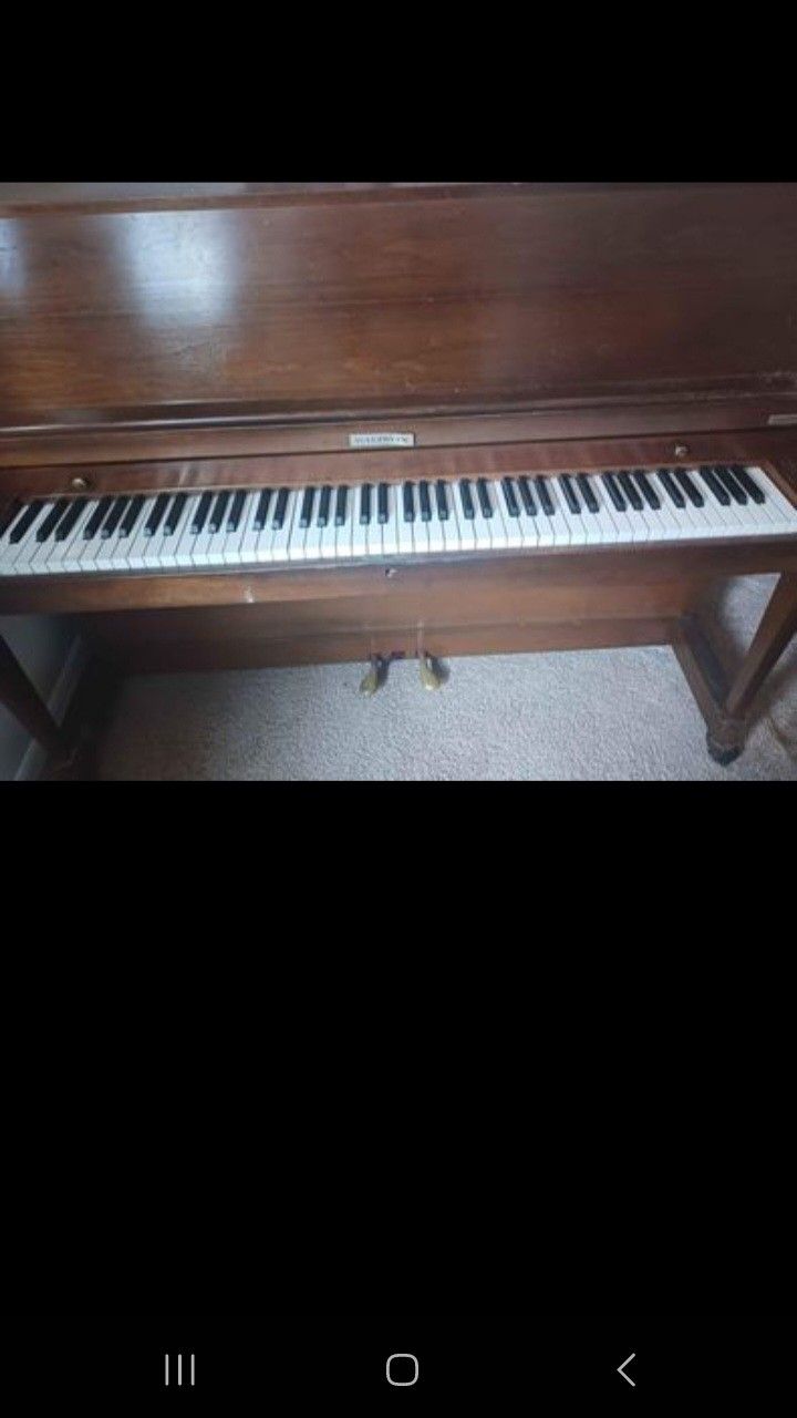 Baldwin oak piano 