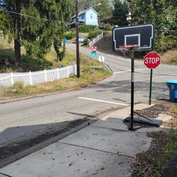 THE LIFETIME BASKETBALL HOOP OUTDOOR PORTABLE 10 FT HIGH AND ADJUSTABLE 