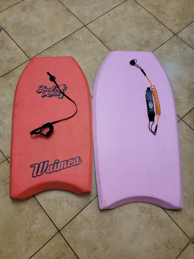 1 local motion waimea boogie board 19 inches , and 1 pink unbranded 39 inch board