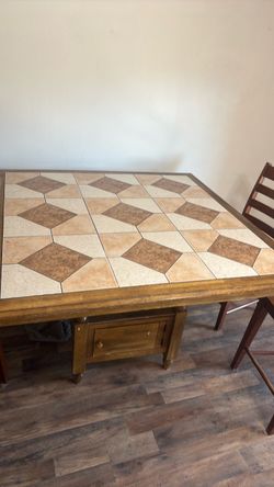 High wooden table with chairs