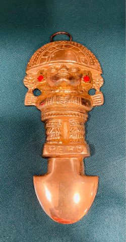 Vintage solid brass Peruvian “ Tumi” Aztec wall hanging with red stone accents