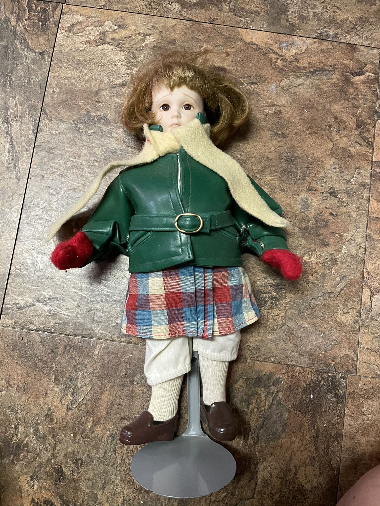 Antique porcelain doll with stand