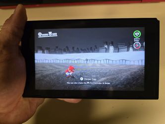 The original Nintendo switch 2017 With Mario Game And The remote controller