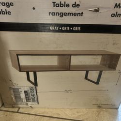 Overview    +4 This is a ClosetMaid 1311 Rectangular Wood Coffee Table with Storage Shelves in gray finish. 