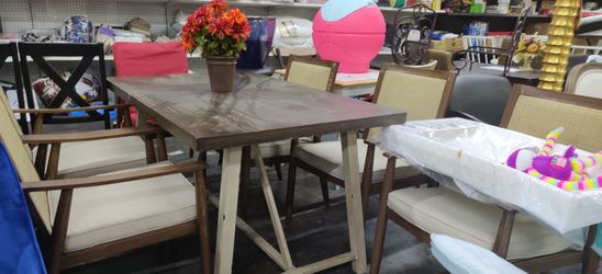 Brand New table and chair set table has some scratches and one chair is missing the cushion