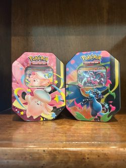 Clefable & Mega Charizard X tins