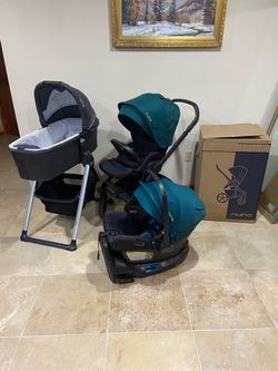 Nuna Mixx Next stroller with car seat and bassinet with stand green canopy