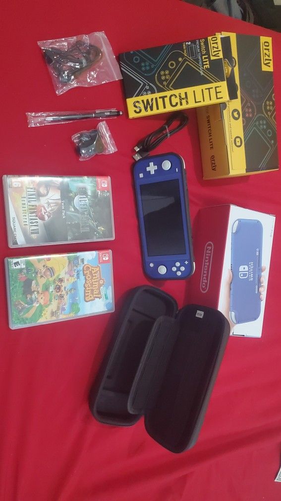 Nintendo Switch Lite Like new  with case and games