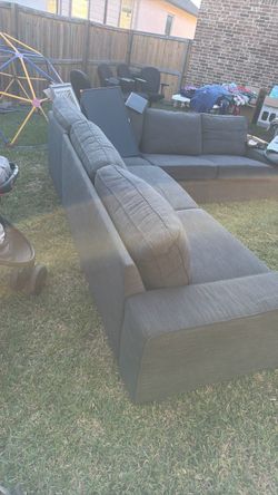 Gray sectional sofa in good condition, firm $150, pickup in Rowlett.