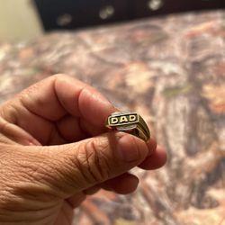 A 10K Men’s Real Gold Ring With The LettersDad. Very firman price.