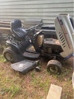 Lawn mower,full size truck tool boxes ,1refrigerator,