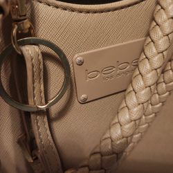 BEBE TAN PURSE W/KEY CHAIN. DARLING. $25