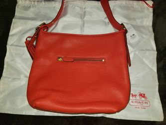 Brand New with Tags Beautiful Coach Pebbled Legacy Leather Duffel Bag in the Vermillion Colorway. (Orange Red)