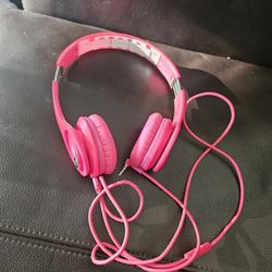 pair of pink Beats by Dr. Dre Solo HD wired on-ear headphones. 