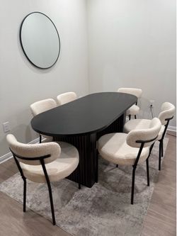 Dining table set with chairs and rug