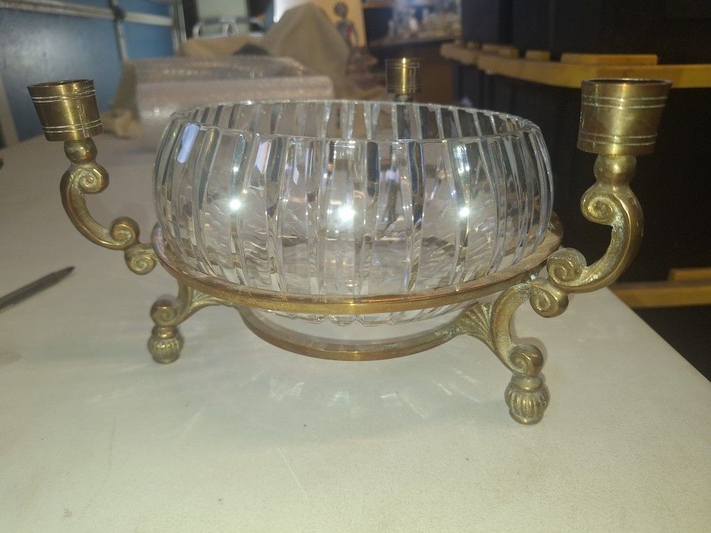 Crystal bowl in a brass rack with 3 candlestick holders. A113C001