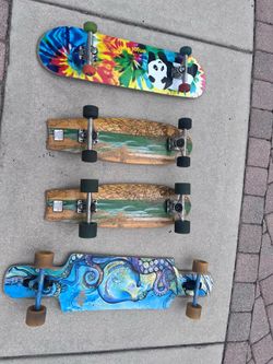 Four skateboards/longboards