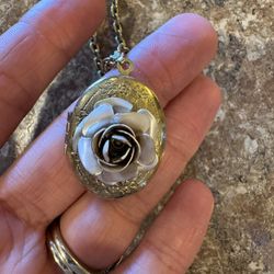 Woman’s vintage locket with a rose on it shipping available